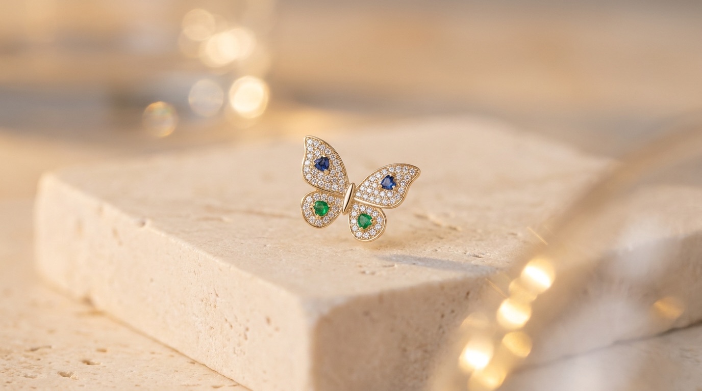 Gold butterfly pendant set with pavé diamonds and gemstone hearts